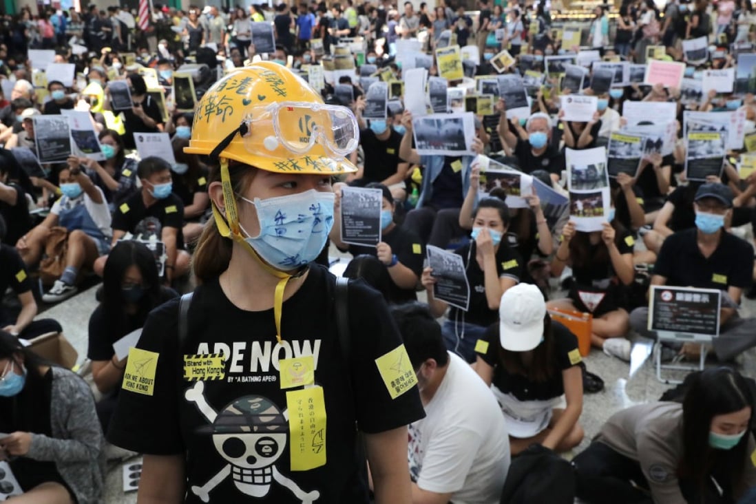 Black T-shirts, helmets and masks are a common sight among Hong Kong protesters. (Picture: Edmond So/SCMP)