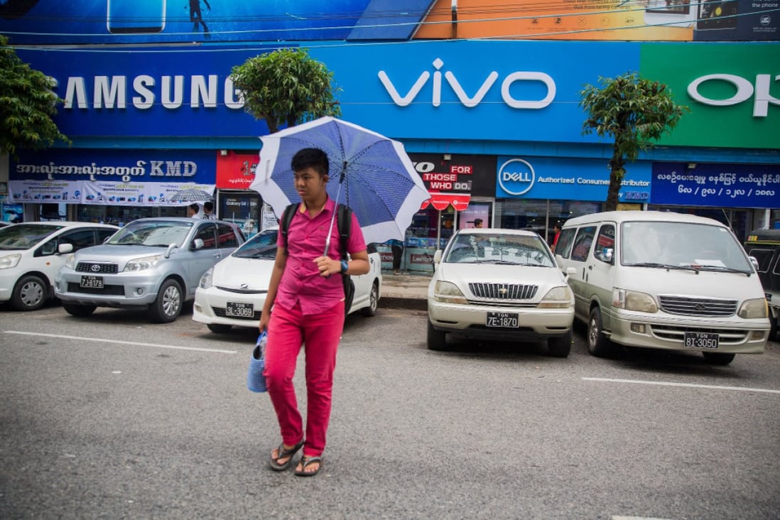 Oppo and Vivo are relying on high visibility to compete with the likes of Samsung, as seen here in Myanmar in 2017. (Picture: Taylor Weidman/Bloomberg)