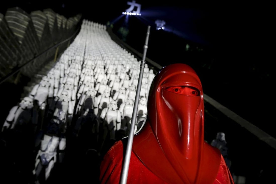 A fan dressed in costume attends a promotional event for Star Wars: The Force Awakens at the Great Wall. (Picture: Reuters)