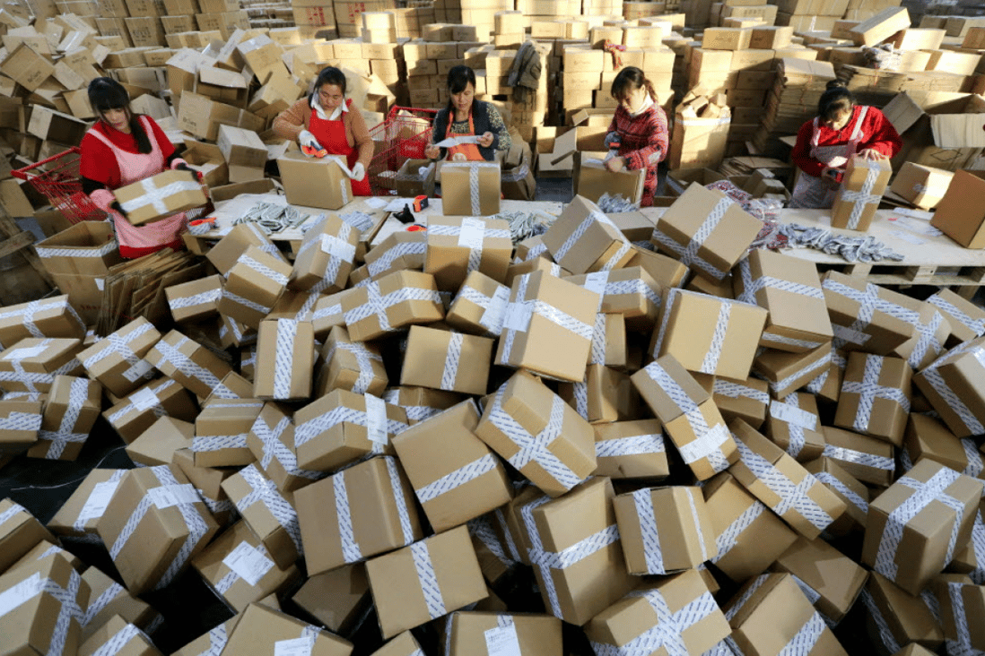 Workers prepare packages for delivery during Singles’ Day in 2016. (Picture: AFP)