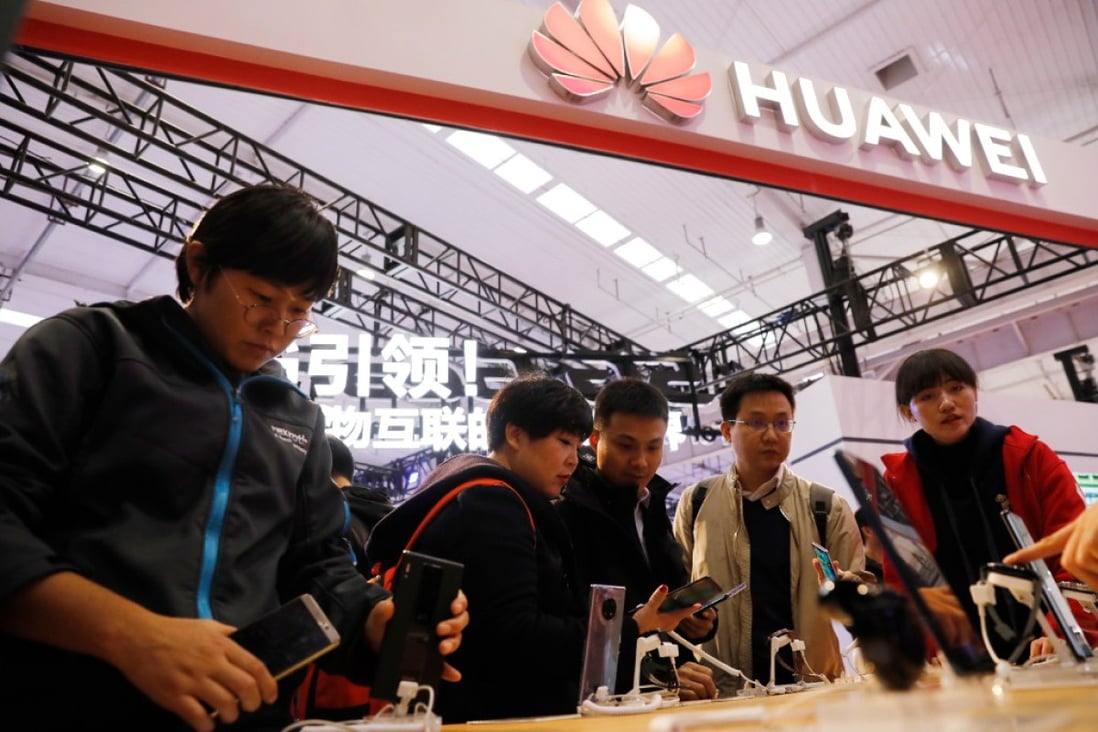 Visitors trying out Huawei’s 5G phones during the World 5G Convention in Beijing on November 21, 2019. (Picture: Wu Hong/EPA-EFE)