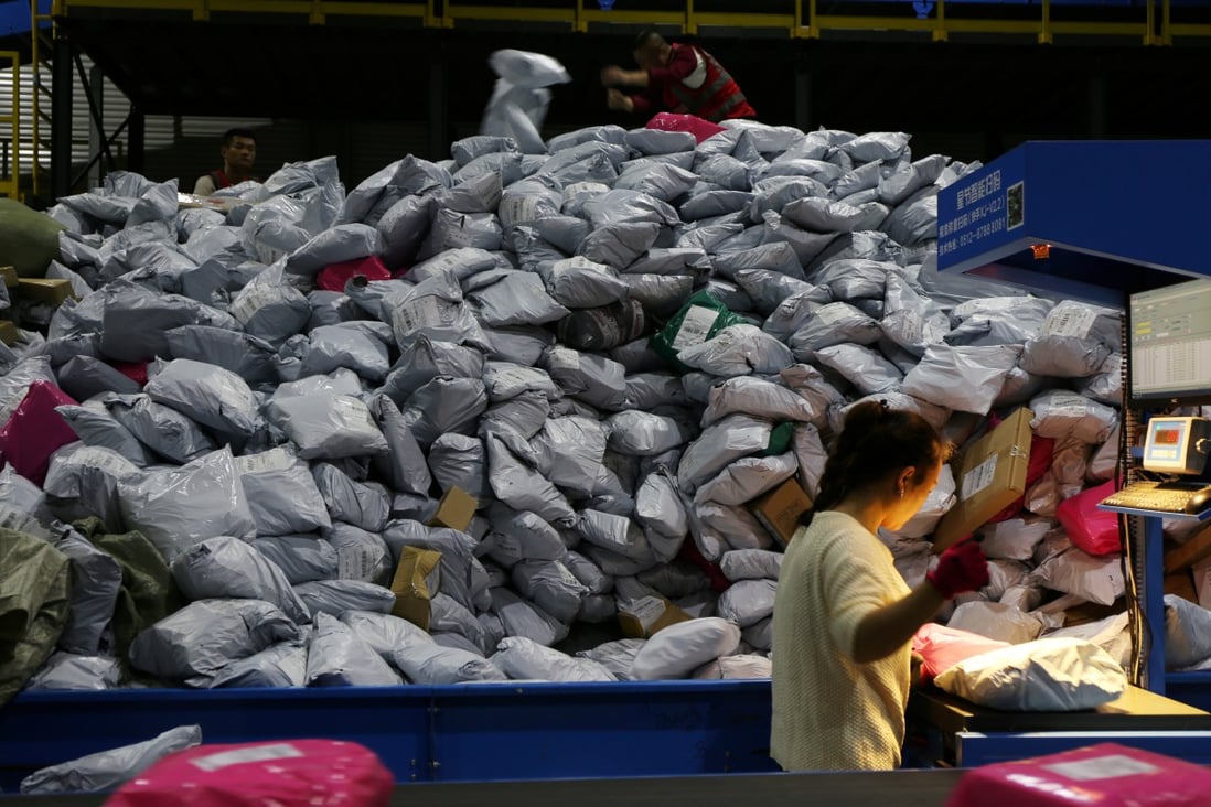 Employees sort parcels at a logistics base during the Singles' Day online shopping festival in Yiwu, Zhejiang province on November 11, 2019. (Picture: Reuters)