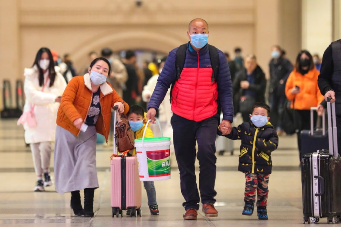Travelers wearing face masks at Hankou Railway Station in Wuhan in southern China's Hubei province on January 21. (Picture: AP)