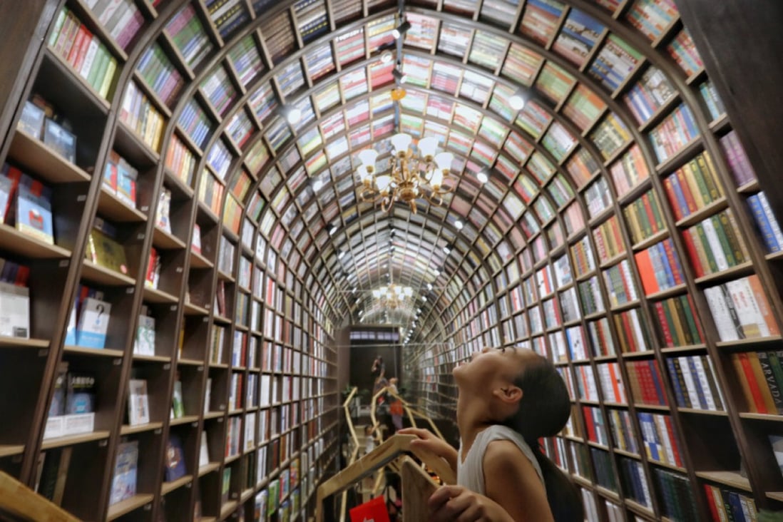 A girl looks up at the ceiling at a newly opened bookstore in Beijing on July 19, 2019. (Picture: Simon Song/SCMP)