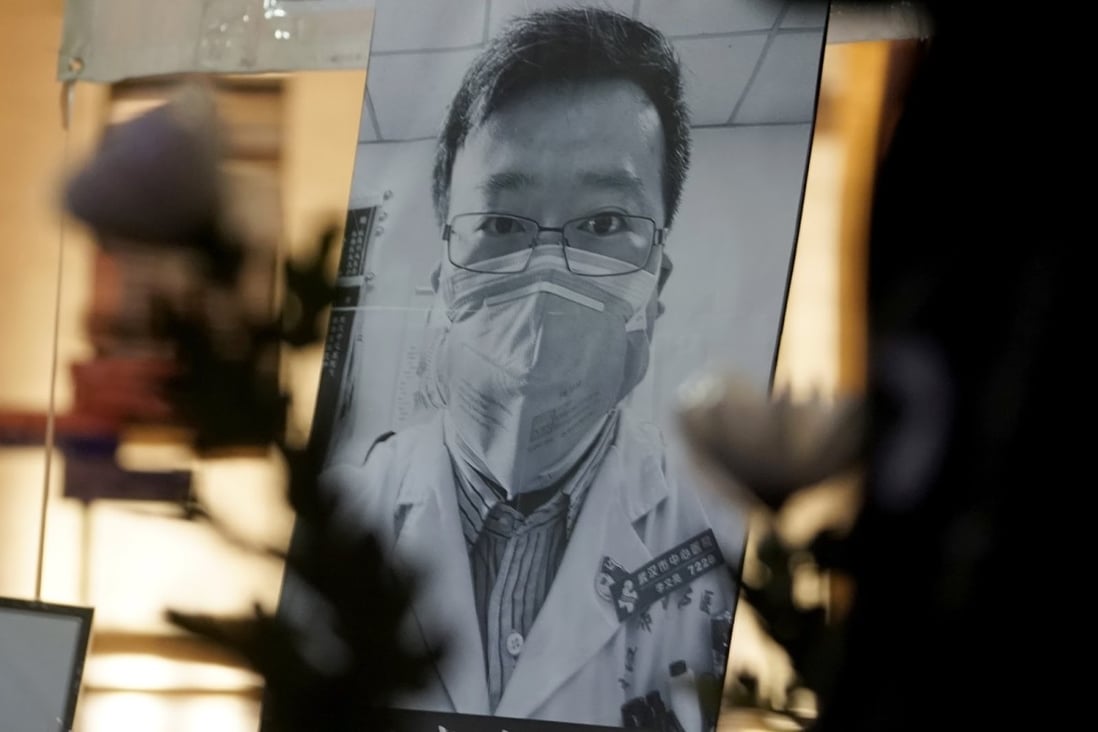 A photo of Chinese doctor Li Wenliang seen in Hong Kong as people attend a vigil on February 7. (Picture: AP)