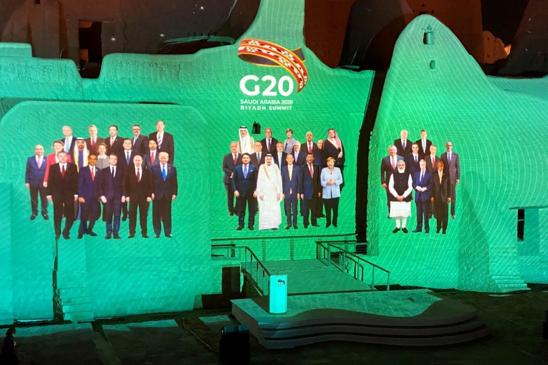 Projection of a "Family Photo" for the annual G20 leaders' summit onto Salwa Palace in At-Turaif, one of Saudi Arabia's UNESCO World Heritage sites, in Diriyah, Saudi Arabia. Photo: Reuters