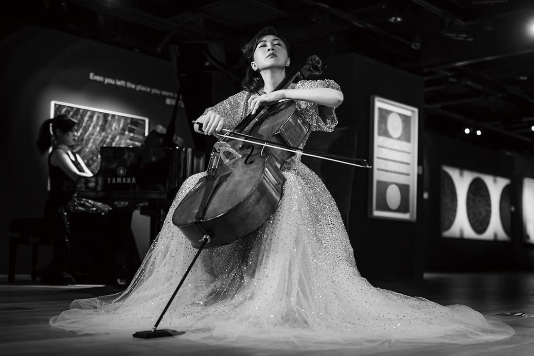 Acclaimed classical musician-turned-jewellery-artist Anna Hu performs at a charity auction.
