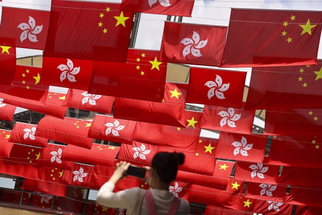 National and Hong Kong flags on display to celebrate the 24th anniversary of the handover in 2021. Photo: May Tse