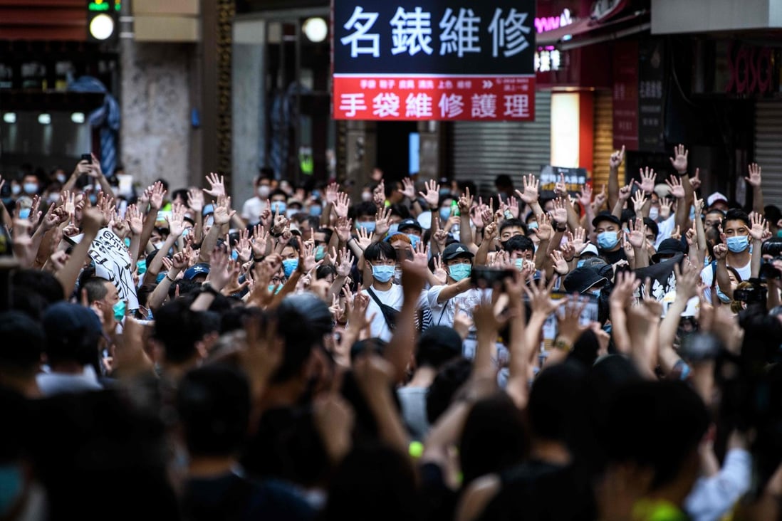 Protesters chant slogans and gesture during a rally against a new national security law in Hong Kong on July 1, 2020, on the 23rd anniversary of the city’s handover from Britain to China. Photo: AFP