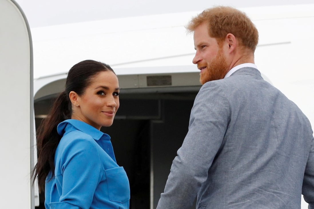 Britain’s Prince Harry and Meghan, Duchess of Sussex look on before departing from Fua’amotu International Airport in Tonga October 26, 2018. Photo: Reuters