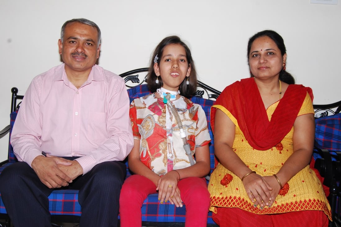 Prassana Shirol (left), his wife Sharadha and their daughter Nidhi (centre). His daughter’s hours-long treatments for a rare, lifelong disease led to Shirol setting up rare disease centres in public and private hospitals in India. Photo: courtesy of the Shirol family