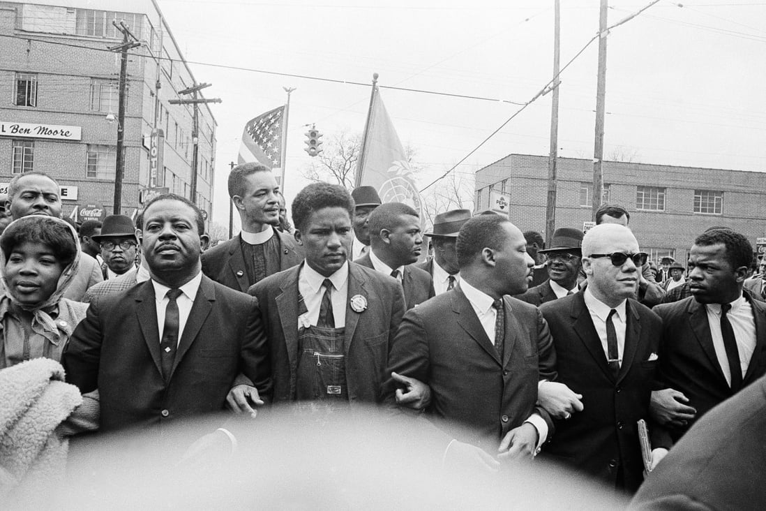 Dr Martin Luther King Jr (fourth from left) marches in his Sunday best, in Alabama, in the United States, in the 1960s. Photo: AP