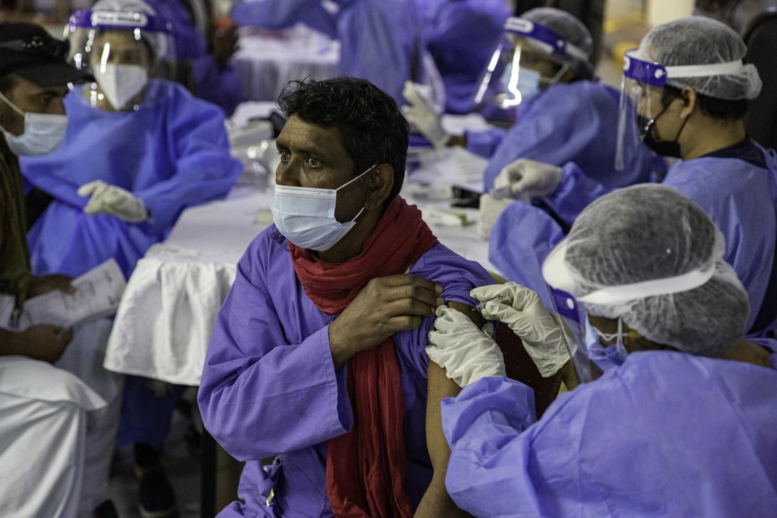 A health care worker administers a dose of the Sinopharm vaccine in Dubai, on February 8. Photo: Bloomberg