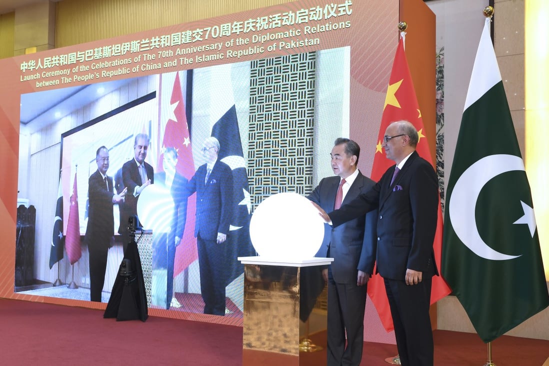 Foreign Minister Wang Yi (second right) attends a virtual ceremony with Pakistani Foreign Minister Shah Mahmood Qureshi to formally commence the celebrations of the 70th anniversary of diplomatic relations between the two countries in Beijing on March 2. Photo: Xinhua