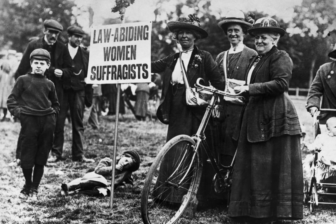 Suffragettes who cycled from various parts of England to London to attend a 1913 meeting, advertise that they are law-abiding. Photo: Getty Images