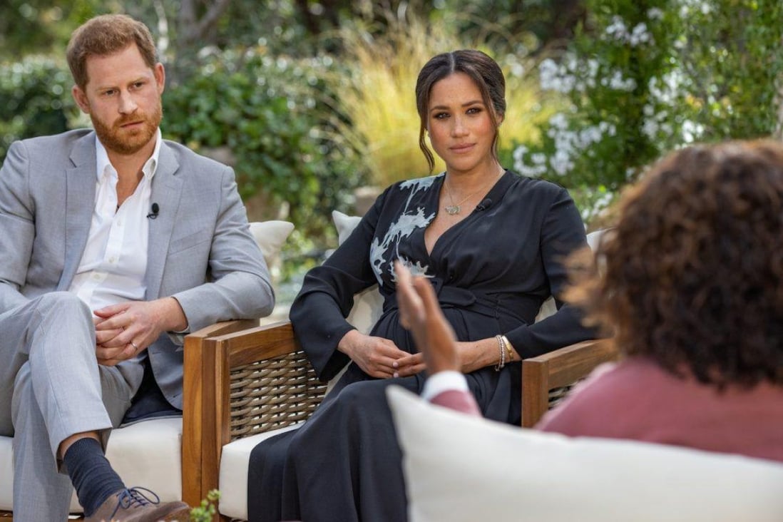 Prince Harry and his wife, Meghan, interviewed by Oprah Winfrey. Meghan wore a US$4,700 silk dress by Armani. Photo: CBS 