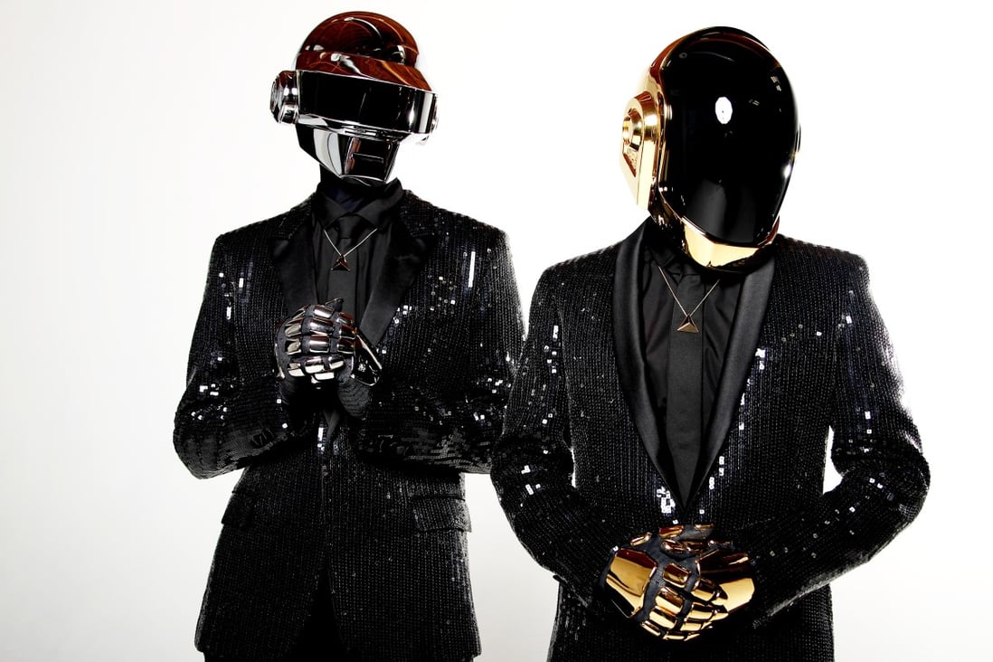 Thomas Bangalter, left, and Guy-Manuel de Homem-Christo, aka Daft Punk, pose for a portrait in their signature robot helmets to promote what would turn out to be their final album, “Random Access Memories” in 2013. Photo: AP