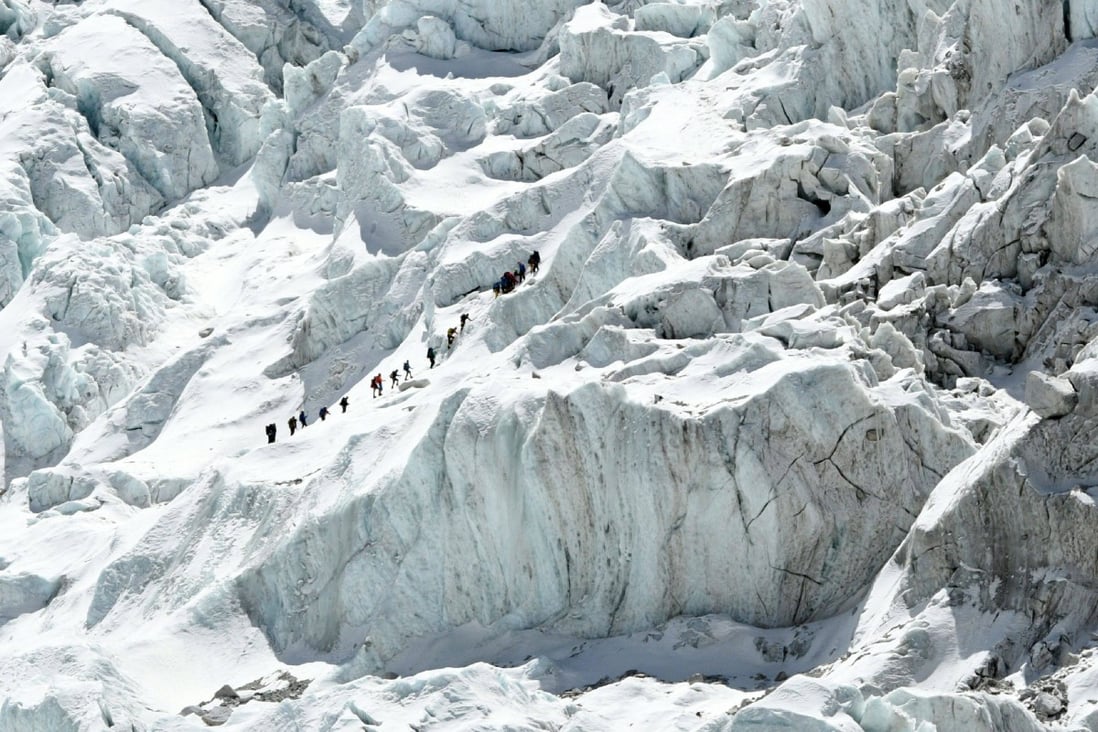 Climbers cross the Khumbu icefall of Mount Everest. The route across is prepared at the start of the climbing season by highly skilled Nepalese mountaineers. Photo: AFP/Prakash Mathema
