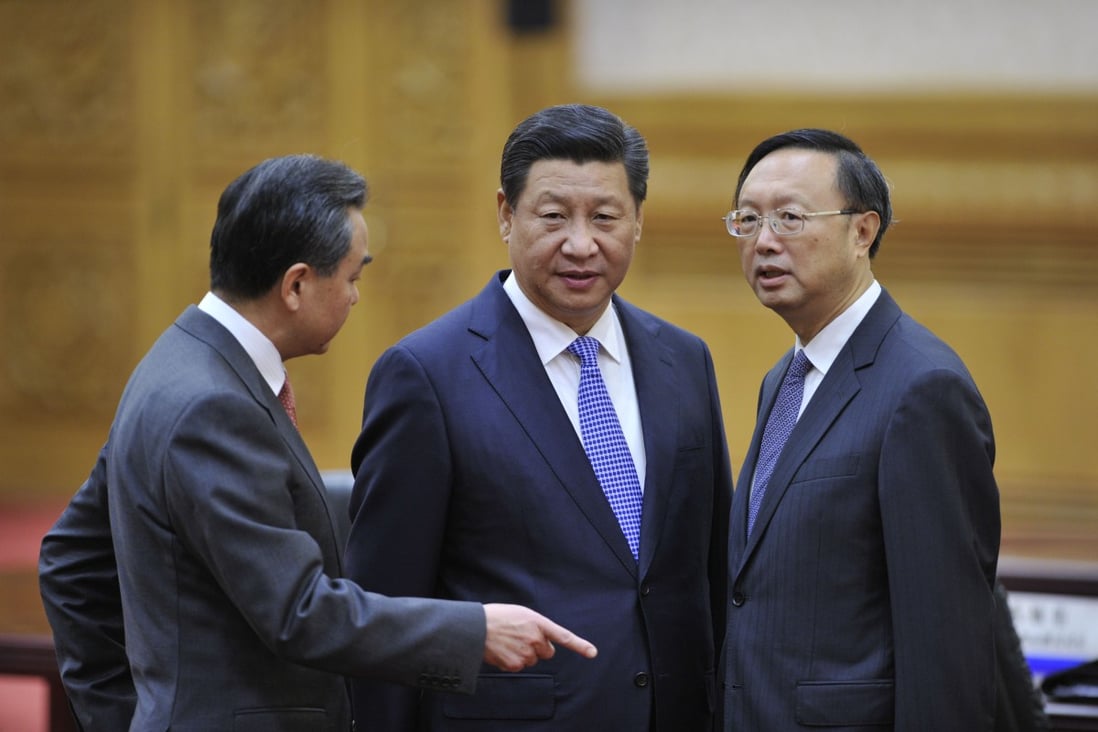 Chinese Foreign Minister Wang Yi (left) and State Councillor Yang Jiechi (right) with President Xi Jinping before a meeting at the Great Hall of the People in 2014. Beijing’s willingness to plunge into what will surely be tough discussions so soon after the NPC meetings should be celebrated. Photo: Getty Images