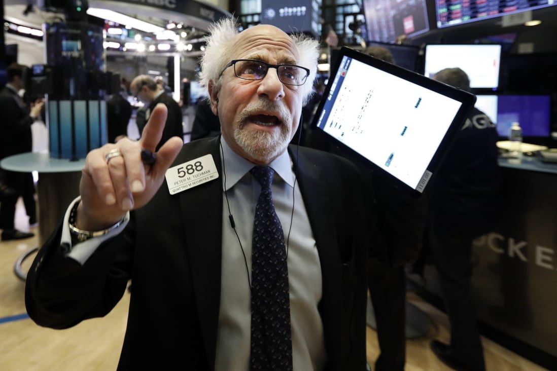 A trader on the floor of the the New York Stock Exchange on January 27, 2020. Global market capitalisation now exceeds global GDP. Photo: AP
