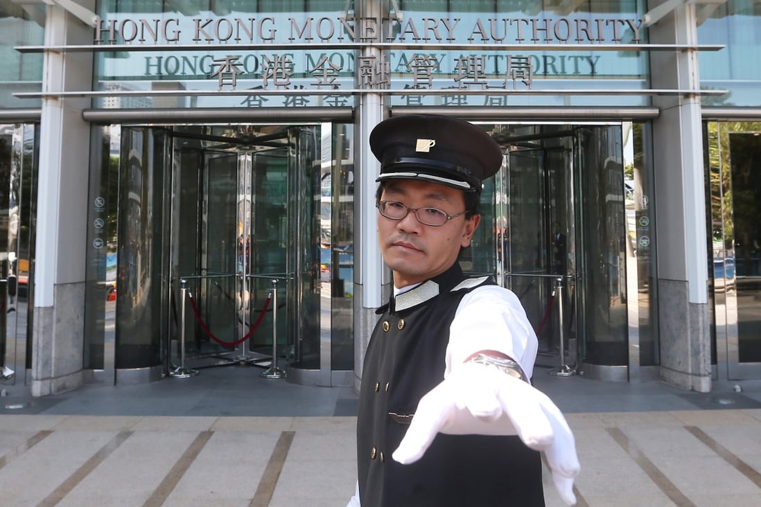 A security guard in front of the Hong Kong Monetary Authority. Photo: SCMP