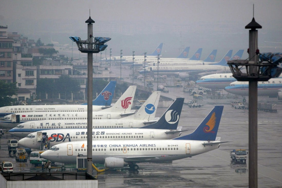 Passenger jets are parked at the Baiyun International Airport in Guangzhou. Photo: Reuters