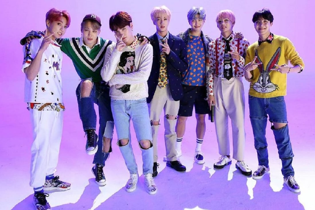 K-pop boy band BTS were depicted on a Topps trading card beaten and bruised. Commenters online called the depictiion violent and racist, and the company withdrew the card and apologised. Photo: Big Hit Entertainment