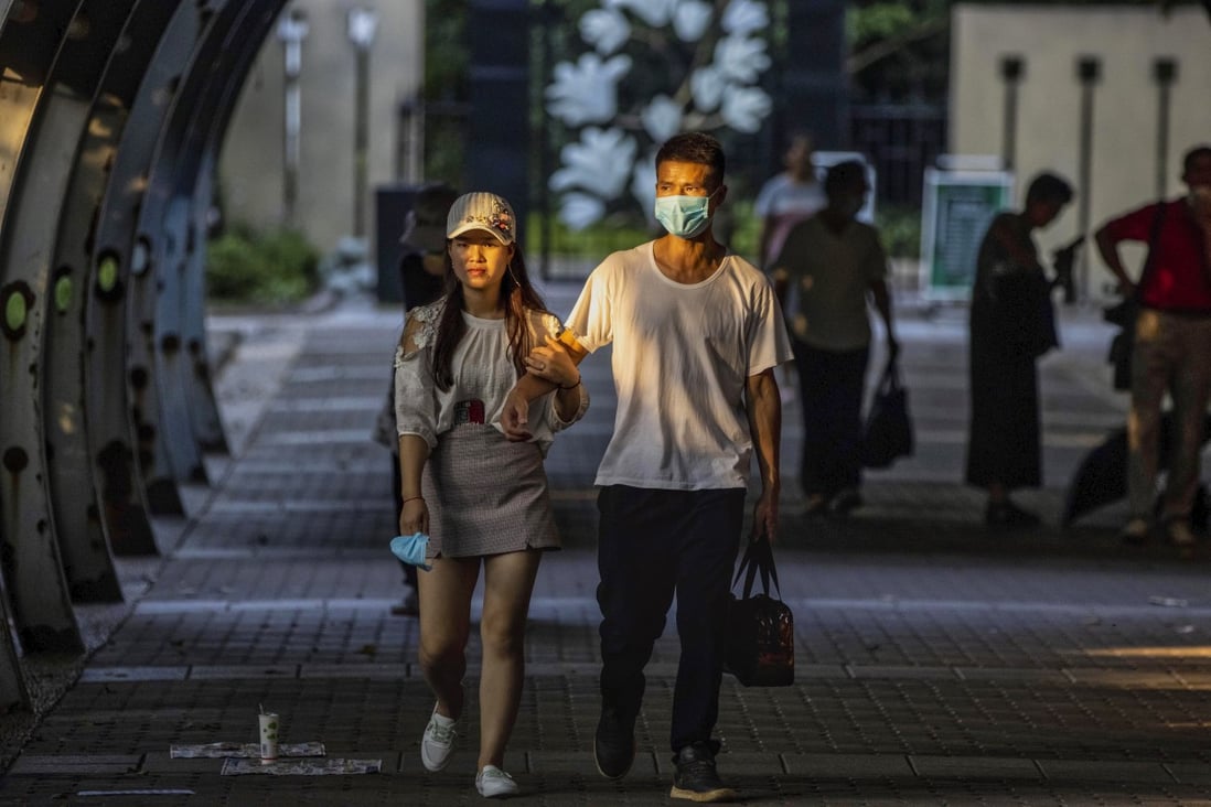 A couple walk through the People’s Park in Shanghai, China, on August 9, 2020. Photo: EPA-EFE