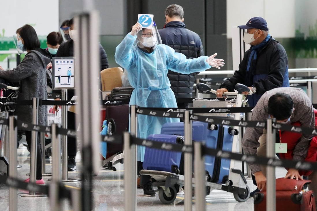 A passenger from London arrives at Hong Kong airport on December 22, 2020. All arrivals must undergo a 21-day quarantine in a designated hotel. Photo: Nora Tam