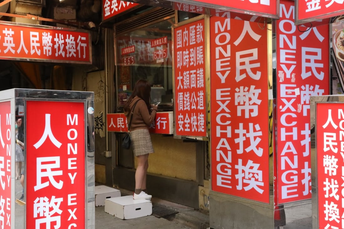 Light boxes showing renminbi (yuan) currency available outside a money changer’s shop in Kwai Chung in Hong Kong on October 15, 2020. Photo: K.Y. Cheng 
