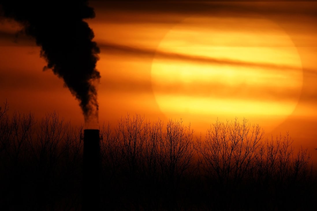 Emissions from a coal-fired power plant are silhouetted against the setting sun in Independence, Missouri, in the US, on February 1. Photo: AP 