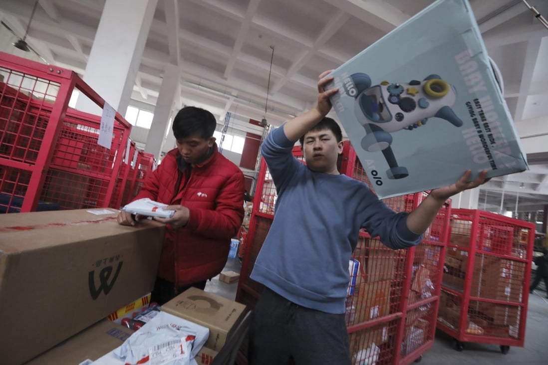 Workers sort out packages for delivery at JD’s Yizhuang Smart Delivery Station in Beijing, Nov 11, 2020. Photo:  SCMP/Simon Song