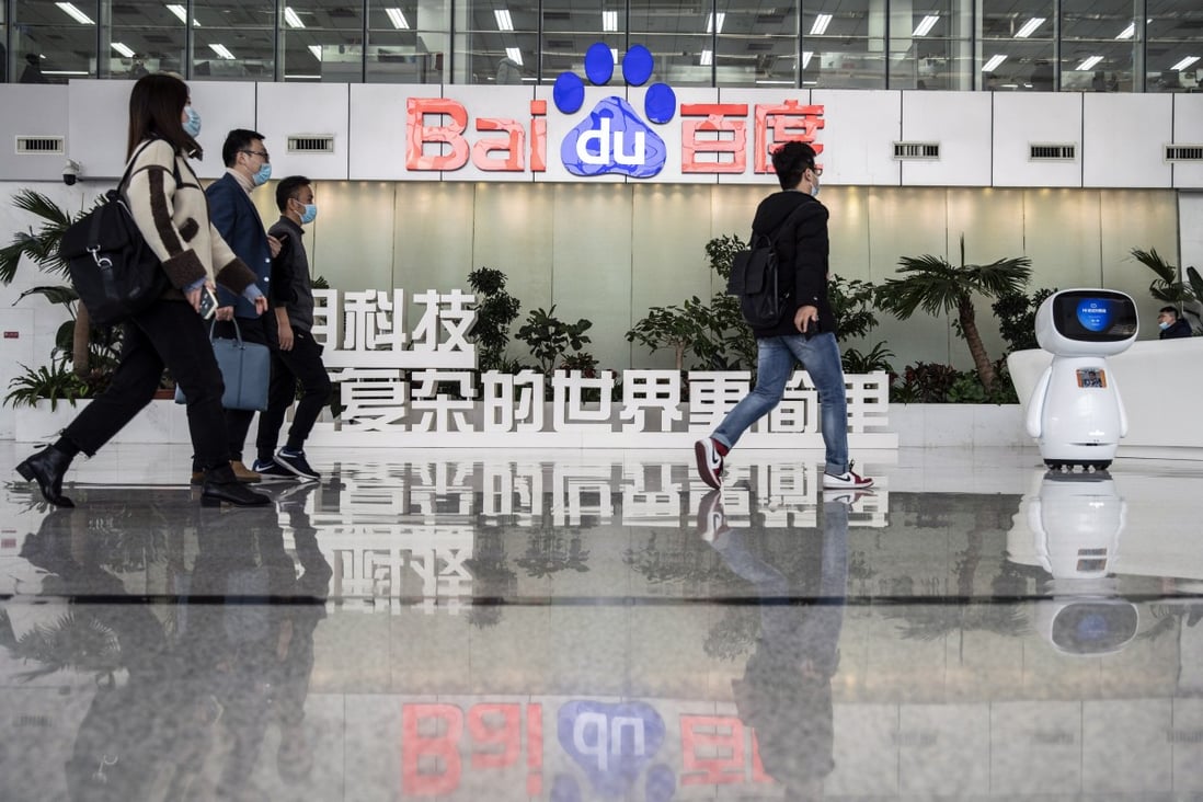 Employees walk through a lobby at Baidu’s headquarters in Beijing on Thursday, March 4, 2021. Photo: Bloomberg