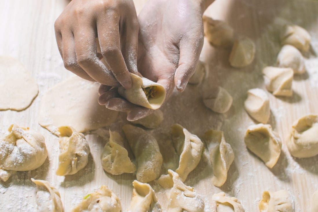 A woman makes dumplings. A food eaten from Western Europe to Siberia and China, the dumpling’s origin is thought to lie in the Middle East. Photo: Getty Images/iStockphoto