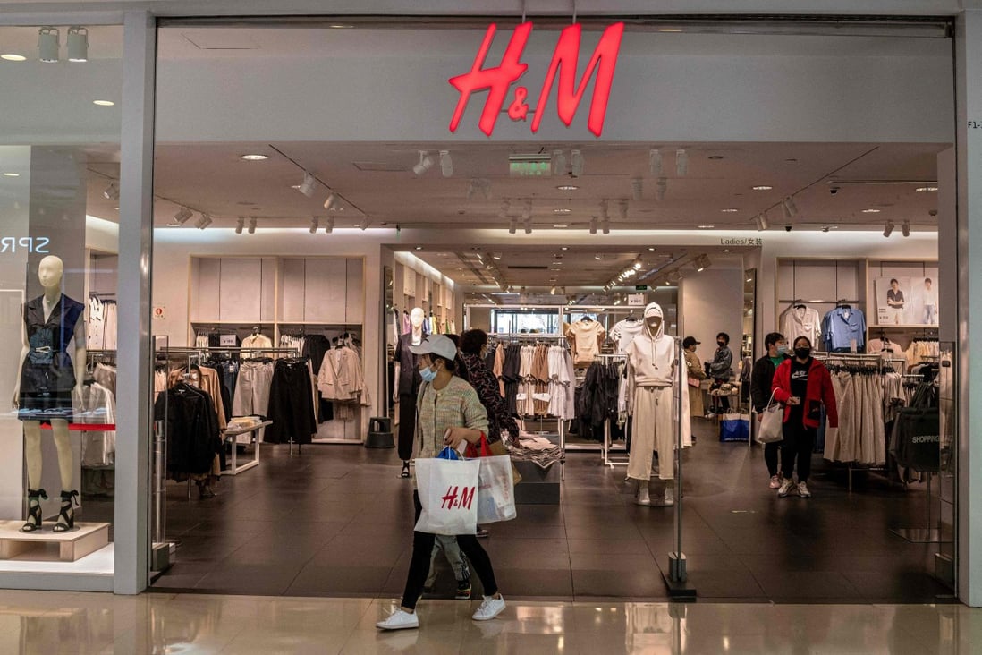 A woman leaves a store of Swedish clothing giant H&M in Beijing on March 25, 2021. Photo: AFP
