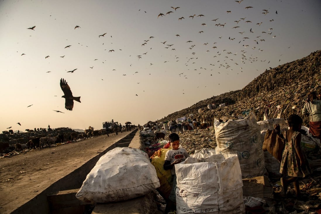 Child scavengers look for recyclable material at a landfill on the outskirts of Gauhati, India, on February 4. Photo: AP