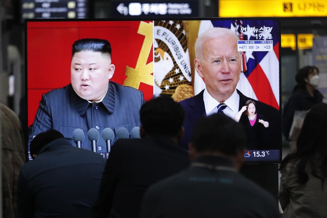 Commuters in Seoul watch a television showing a file image of North Korean leader Kim Jong-un and US President Joe Biden on March 26. Photo: AP