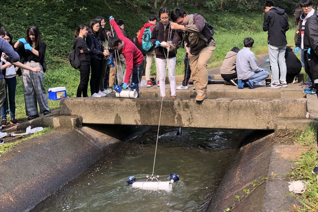 The School of Science and Technology at the Open University of Hong Kong (OUHK) has been part of FreshWater Watch. Here students  practice  water sampling. Photo: Open University of Hong Kong