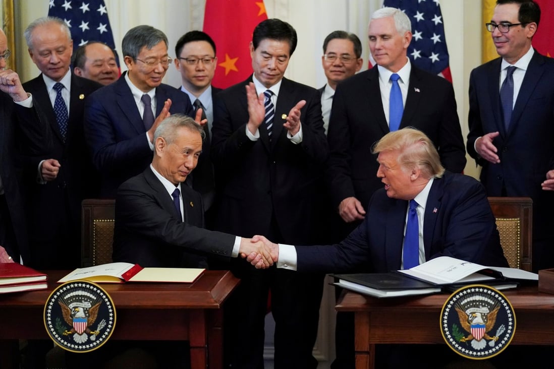 Chinese Vice-Premier Liu He and US President Donald Trump after signing phase one of the US-China trade agreement during a ceremony at the White House on January 15, 2020. Photo: Reuters