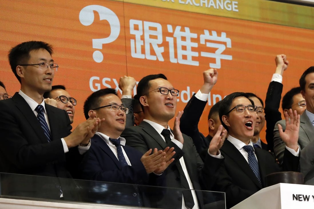 GSX Techedu chairman and CEO Larry Chen Xiangdong (right), along with members of the company's leadership team, celebrate their IPO as they ring the New York Stock Exchange opening bell on June 6, 2019. Photo: AP Photo
