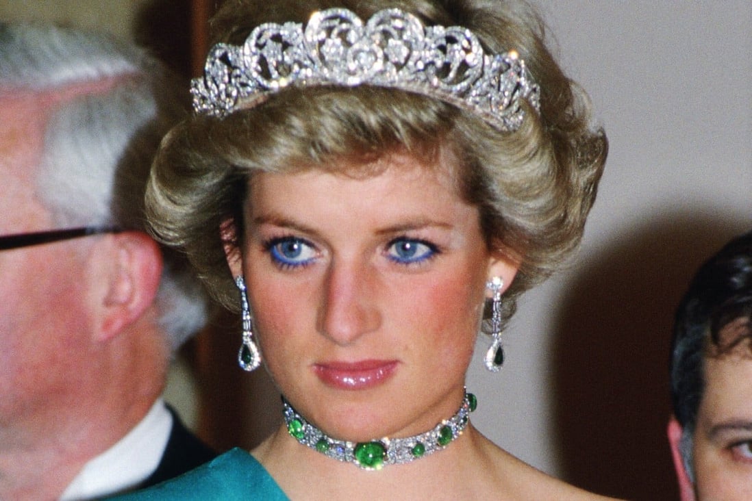 Princess Diana knew how to use green jewellery to great effect, pictured here with Queen Mary’s emerald and diamond choker. Photo: Getty Images