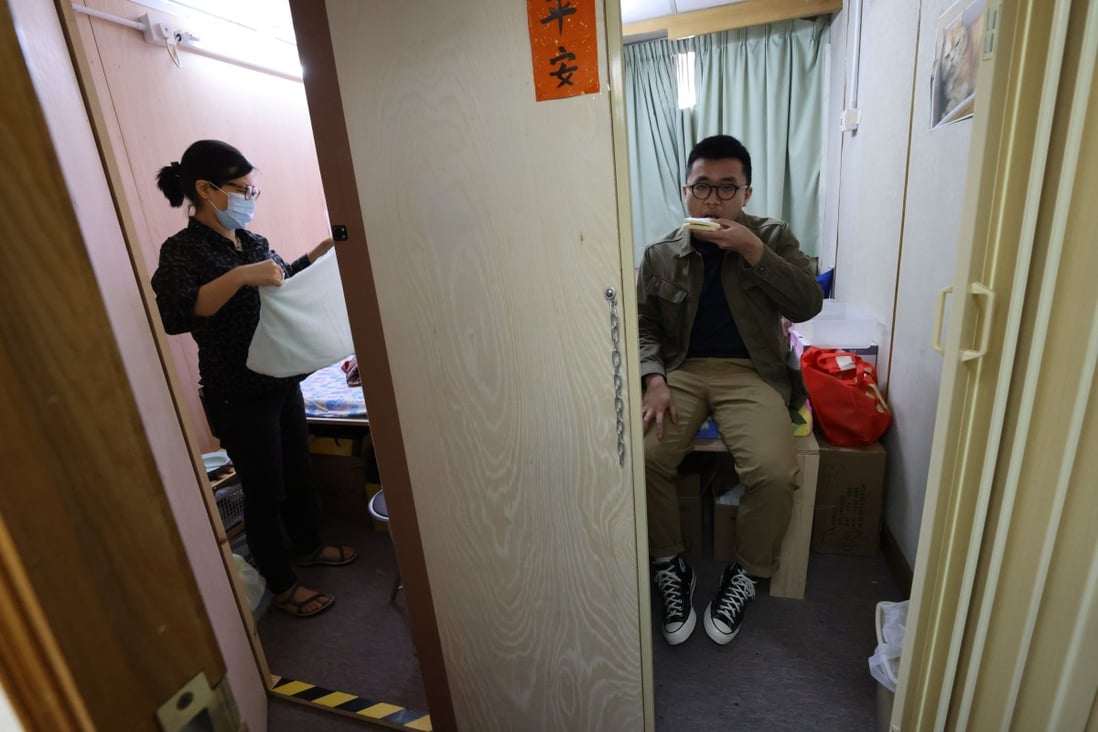 Yau Tsim Mong district councillors Suzanne Wu Sui-shan  and Isaac Ho Cheuk-hin attend a simulation of sub-divided flats in Hong Kong on March 14. Photo: Dickson Lee
