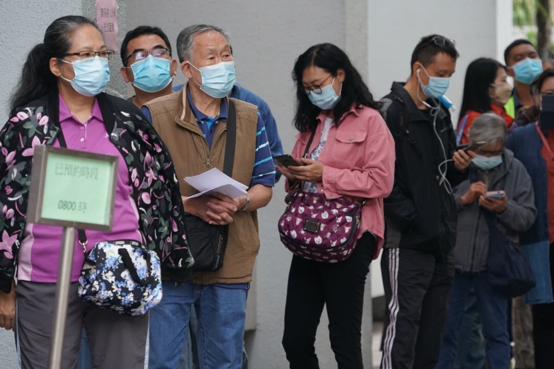 People queue up for Covid-19 jabs at Hong Kong’s Sha Tin Community Vaccination Centre.
Photo: Felix Wong
