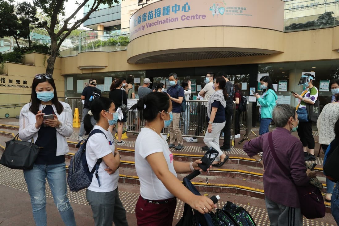 People queue up for Covid-19 vaccinations at Hong Kong Central Library in Causeway Bay on March 30. Photo: Edmond So