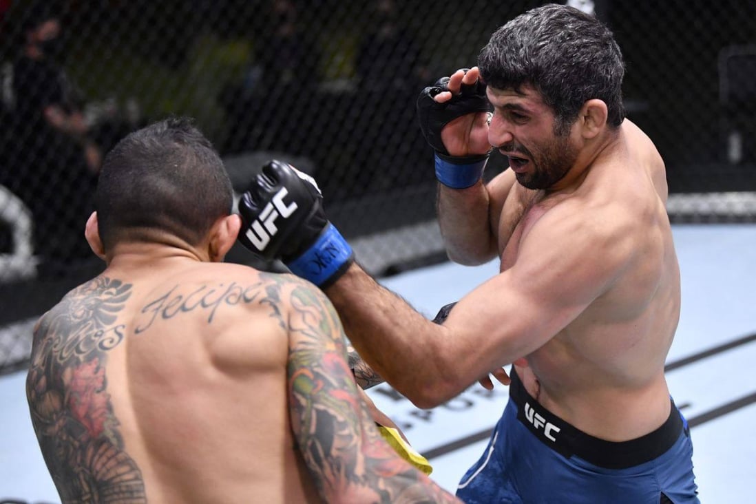 Beneil Dariush punches Diego Ferreira in their lightweight bout at UFC Fight Night on February 6, 2021 at the Apex facility in Las Vegas Nevada. Photo: Chris Unger/Zuffa LLC via Getty Images