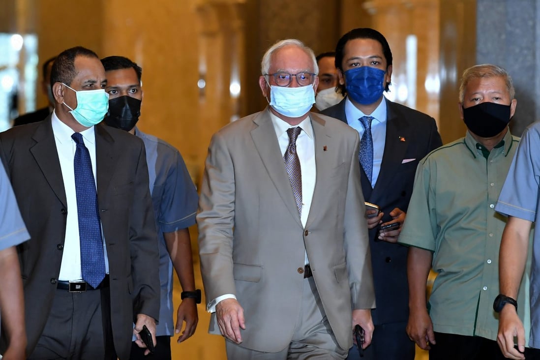 Former Malaysian prime minister Najib Razak arrives at court for his appeal against his conviction and jail sentence for abuse of power, criminal breach of trust and money laundering. Photo: DPA