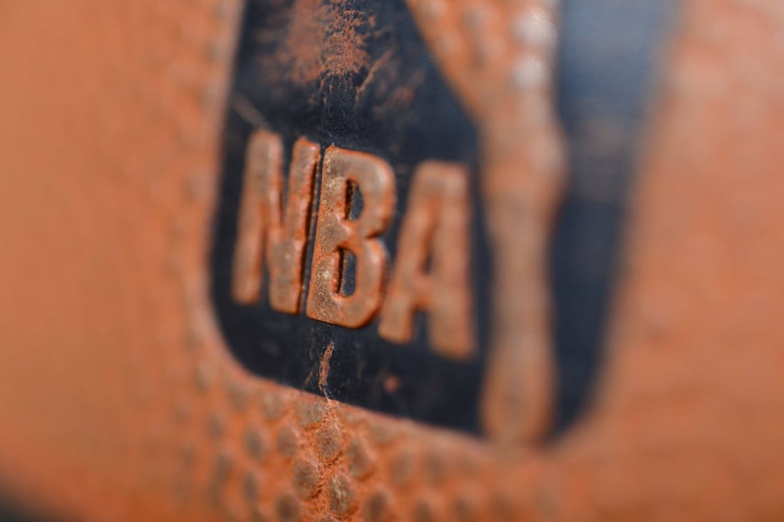 The NBA logo is seen on a Spalding ball ahead of an NBA game. Photo: AFP

