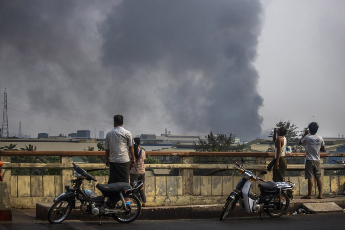 Smoke billows from the industrial zone of Hlaing Thar Yar, in Yangon, Myanmar, home to Chinese-run factories. Photo: AP