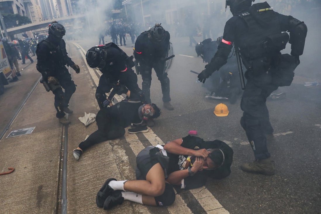 Riot police arrest protesters during an anti-extradition bill march in September 2019. Photo: Sam Tsang