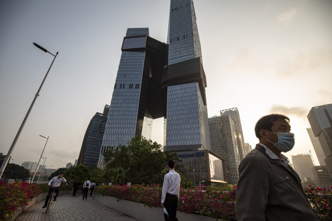 People walk along a pedestrian walkway near the Tencent Holdings headquarters in Shenzhen on March 20. Photo: Bloomberg